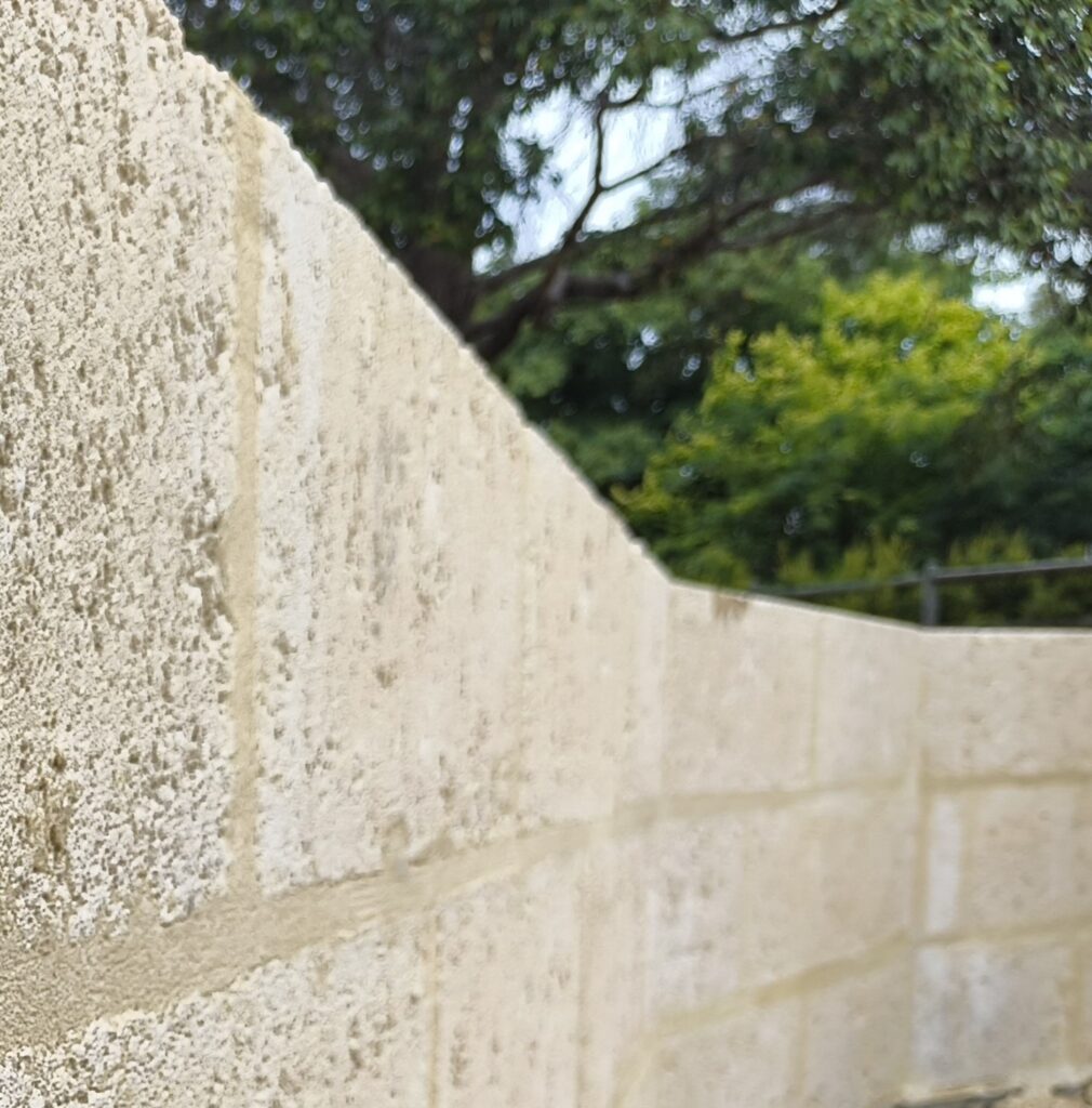 Limestone retaining wall with flush joints rustic look